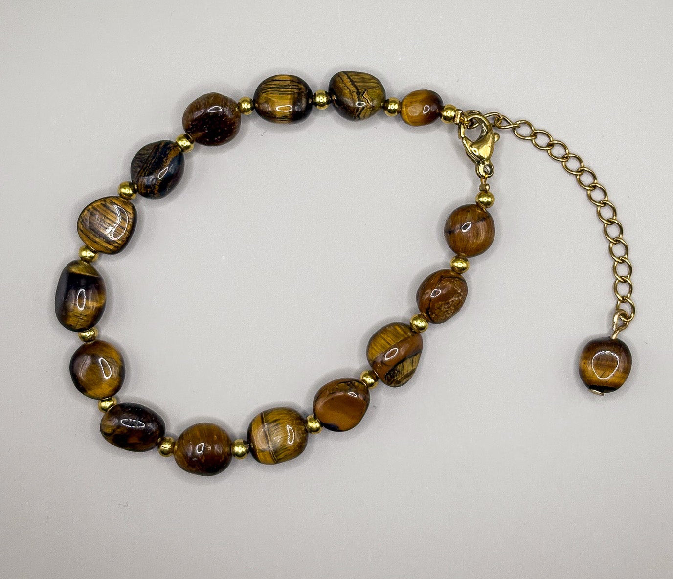 „Bransoletka z tygrysiego oka na złotych akcentach – Kolekcja Basic”
„Naturalne Tygrysie Oko – bransoletka ochrona i siła”